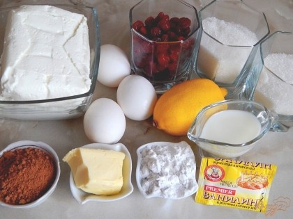 Для приготовления сырника нам понадобятся: творог, яйца, ванилин, сахар, цедра лимона, крахмал, вишня вяленая.Для приготовления глазури нам понадобится:сливочное масло, сахар, молоко, какао порошок.